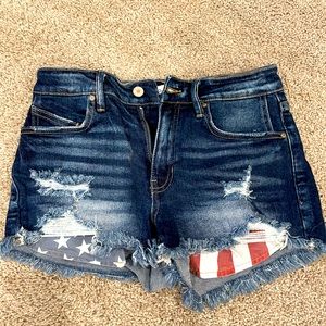 Maurice’s dark washed Kan-Kan patriotic shorts.